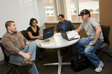 Administrators and teachers at a table