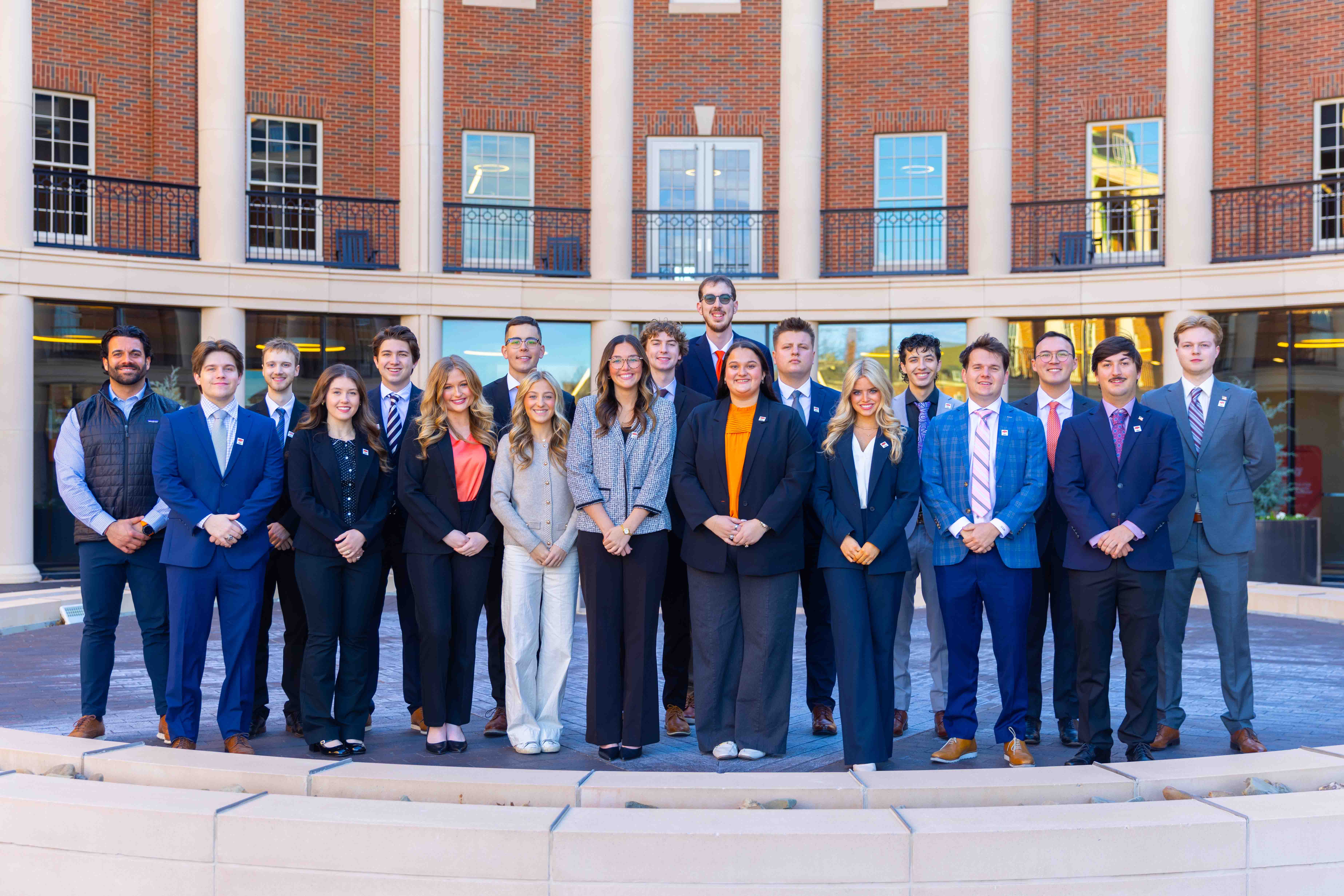 2026 MBA cohort group photo in the Spears courtyard. 38 people in the photo including MBA program directors