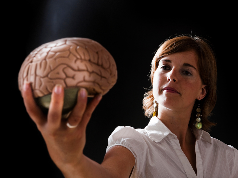 Woman holding a brain