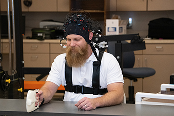 Student hooked up to equipment in the lab