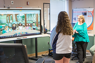 Student and teacher in the teaching lab