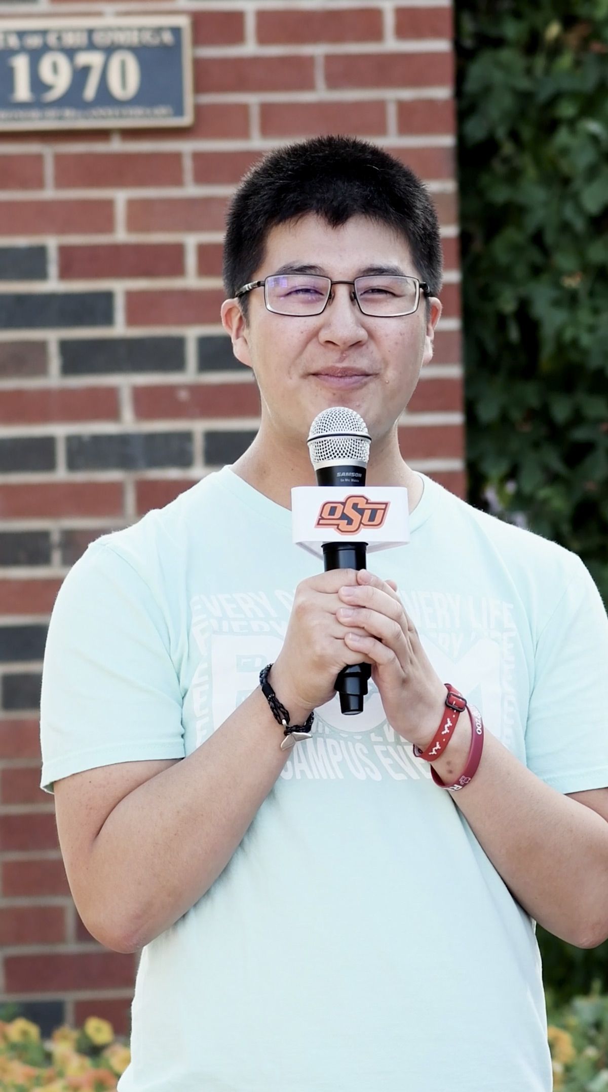 International student with microphone