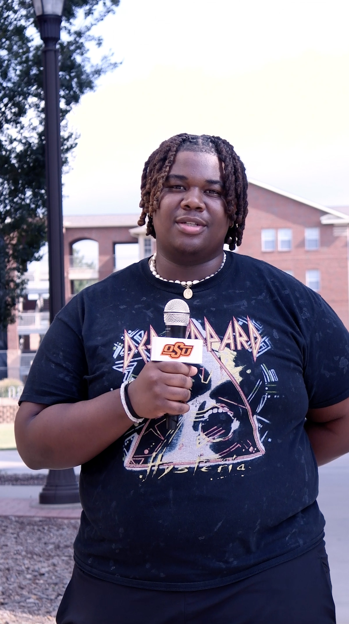 Student holding microphone