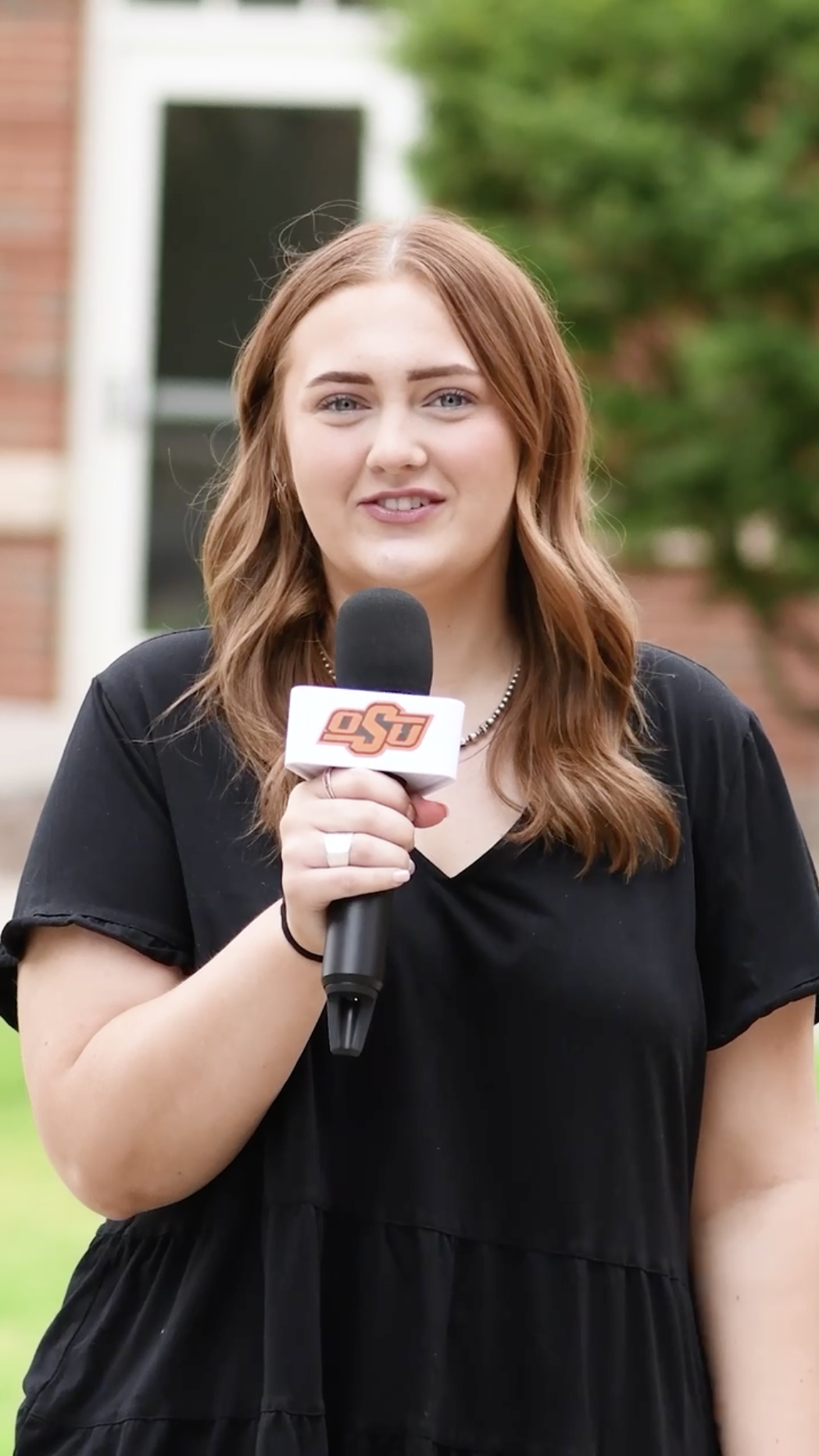 Student holding microphone